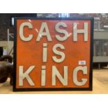 A 'CASH IS KING' ILLUMINATED LIGHT BOX SIGN