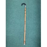 A WALKING STICK WITH AN INTEGRATED YARD STICK MEASURE