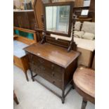 AN OAK DRESSING TABLE ON BARLEY TWIST SUPPORTS WITH THREE DRAWERS AND UPPER BEVEL EDGE MIRROR