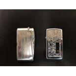 A VINTAGE ZIPPO AND FLICKER LIGHTERS