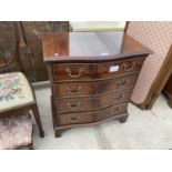 A MAHOGANY SERPENTINE FRONT CHEST OF FOUR DRAWERS