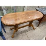 A REPRODUCTION OAK TWIN PEDESTAL CENTRE TABLE