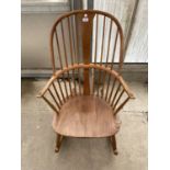 AN ERCOL ELM SEATED WINDSOR STYLE ROCKING CHAIR