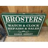A "BROSTERS, WATCH REPAIRS" SUSPENDED SHOP SIGN