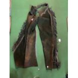 A PAIR OF SUEDE LEATHER FRINGED COWBOY CHAPS