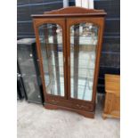 A CHERRY WOOD DISPLAY CABINET WITH TWO GLAZED DOORS