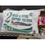 TWO PACKS (TWO PILLOWS PER PACK) OF NECK AND SPINE SUPPORT PILLOWS