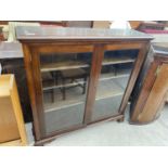 A MAHOGANY BOOKCASE WITH TWO GLAZED DOORS