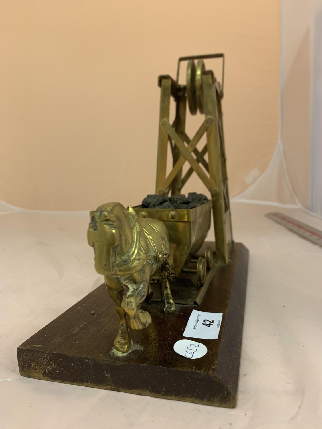 A BRASS MODEL OF A HORSE PULLING COAL FROM MINE ON A WOODEN BASE - Image 2 of 2