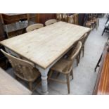 A LARGE PINE FARMHOUSE STYLE DINING TABLE ON TURNED LEGS AND SIX VICTORIAN STYLE CHAIRS