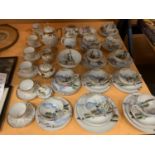 AN ORIENTAL STYLE PART TEA SET WITH CUPS, PLATES SAUCERS, MILK AND SUGAR AND A FURTHER GILT AND