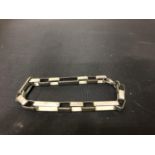 A WHITE METAL SQUARE BRACELET