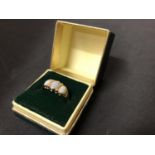 A 9 CARAT GOLD OPAL RING