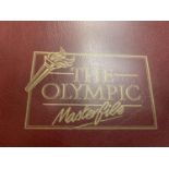 A FOLDER CONTAINING OLYMPIC STAMPS AND WORLD CUP FIRST DAY EDITIONS