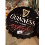 A LARGE GUINNESS BEER BOTTLE CAP WALL DISPLAY SIGN