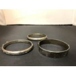 THREE SILVER WRIST BANGLES