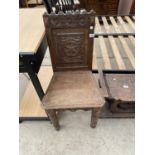 A VICTORIAN CARVED MAHOGANY HALL CHAIR WITH SOLID SEAT