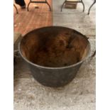 A LARGE VINTAGE CAULDRON