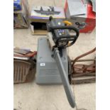 A CASED RYOBI CHAINSAW IN WORKING ORDER