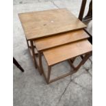 A TEAK NEST OF TABLES