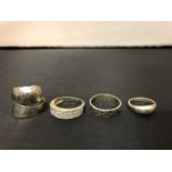 FOUR SILVER RINGS