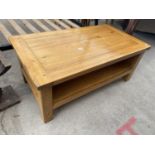 A MODERN OAK COFFEE TABLE WITH LOWER SHELF