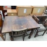 AN OAK DRAW LEAF TABLE AND THREE CHAIRS