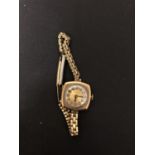 A ROLWATCO LADIES' WRIST WATCH WITH 9CT GOLD CASE AND ROLLED GOLD STRAP