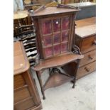 AN EARLY 20TH CENTURY MAHOGANY CORNER CABINET ON OPEN BASE WITH UPPER GLAZED PANEL DOOR