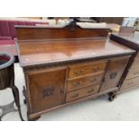 AN EDWARDIAN MAHOGANY ROPE-EDGE SIDEBOARD ON BALL AND CLAW FEET WITH TWO DOORS AND THREE DRAWERS