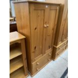 A PINE TALLBOY WITH TWO DOORS AND TWO DRAWERS