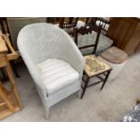 A LLOYD LOOM STYLE ARMCHAIR, A MAHOGANY BEDROOM CHAIR, A LLOYD LOOM STYLE LINEN BOX AND AN OTTOMAN