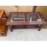 A MODERN MAHOGANY COFFEE TABLE WITH GLASS INSET TOP