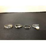 FOUR SILVER RINGS