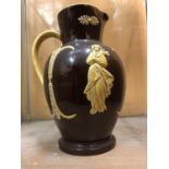 A BROWN GLAZED AND SLIPWARE VICTORIAN JUG