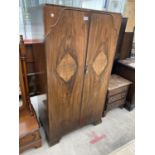 A SMALL WALNUT TWO DOOR WARDROBE