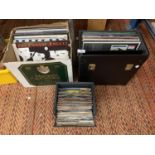 A QUANTITY OF LP'S AND SINGLES WITH CASES