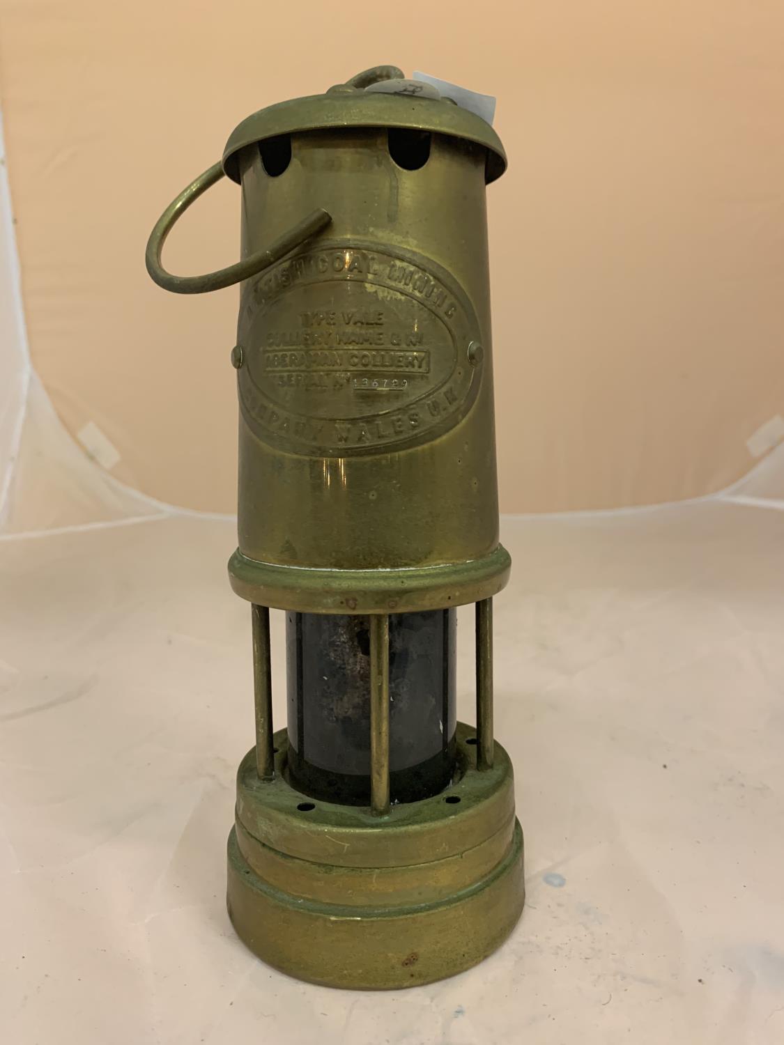 A VINTAGE MINERS LAMP 'BRITISH COAL MINING COMPANY WALES UK ABERAMAN COLLIERY SERIAL NO 136729