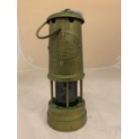 A VINTAGE MINERS LAMP 'BRITISH COAL MINING COMPANY WALES UK ABERAMAN COLLIERY SERIAL NO 136729