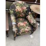 A VICTORIAN FLORAL UPHOLSTERED FIRESIDE CHAIR