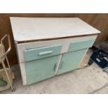 A VINTAGE KITCHEN CABINET WITH TWO DOORS AND TWO DRAWERS