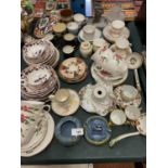A LARGE COLLECTION OF CUPS AND SAUCERS