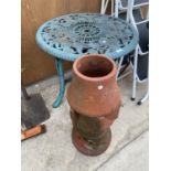 A METAL GARDEN TABLE AND A TERRACOTTA CHIMNEY POT