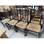 SIX COUNTRY STYLE ELM SPINDLE BACK CHAIRS WITH RUSH SEATS AND TWO LADDER BACK ELM CHAIRS