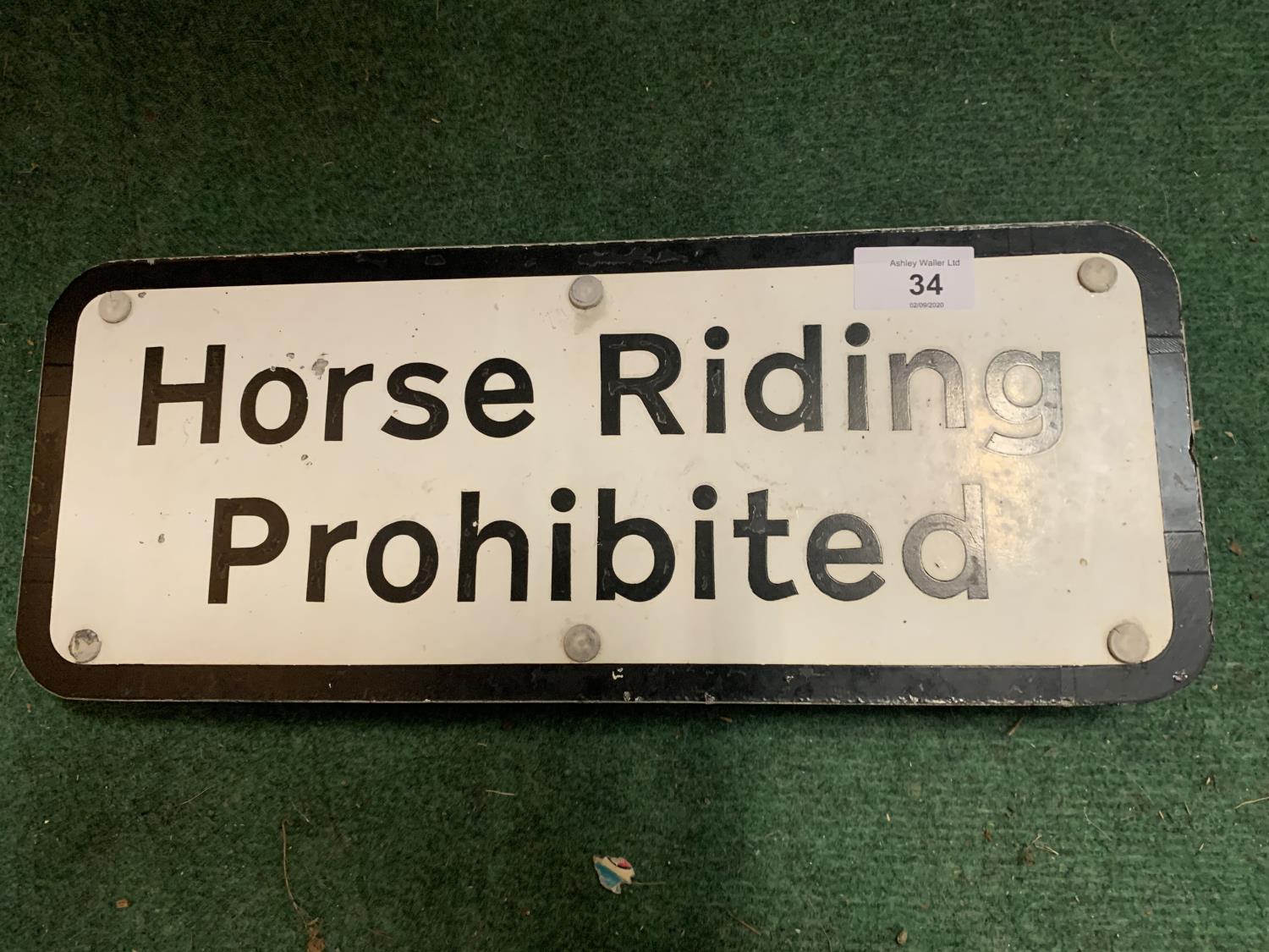 A HORSE RIDING PROHIBITED SIGN