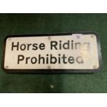 A HORSE RIDING PROHIBITED SIGN