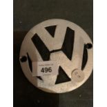 A SMALL CIRCULAR CAST VW SIGN