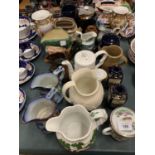 A LARGE COLLECTION OF JUGS AND URNS TO INCLUDE LUSTRE, DOULTON ETC
