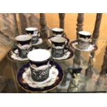 SIX COALPORT COFFEE CUPS AND SAUCERS WITH SILVER HOLDERS