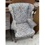 A PARKER KNOLL WINGED BACK ARMCHAIR MODEL P.K. 720/45 MK.3